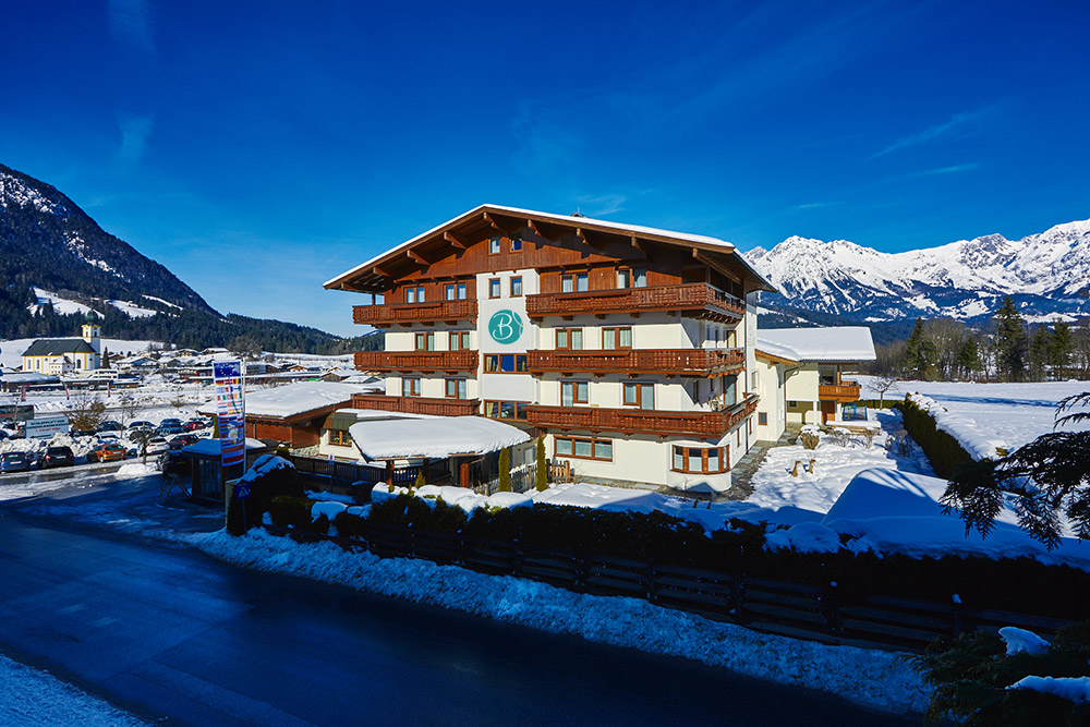 2022_12_haus-winter Foto: Appartement Haus Ihrer Ferienwohnung im Winter in Österreich Wilder Kaiser Söll Tirol für Ihren Urlaub mit Hund.